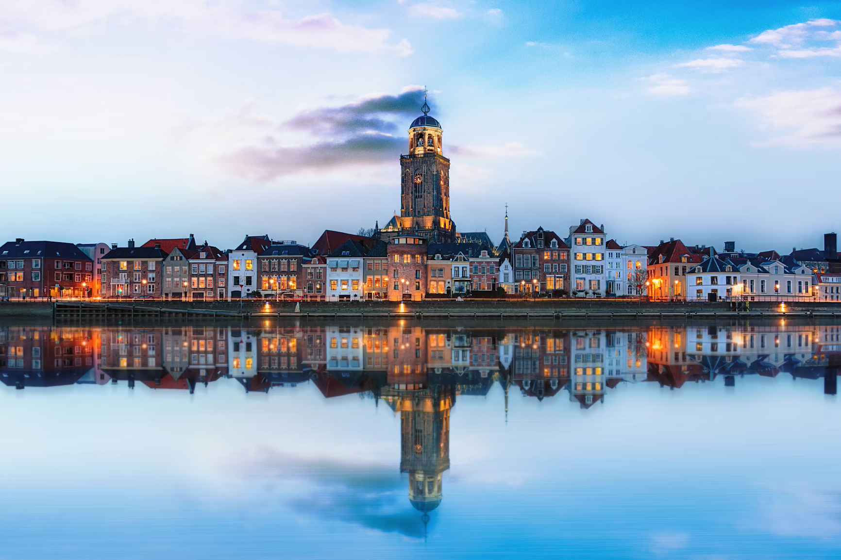 photo of the city being reflected in the water