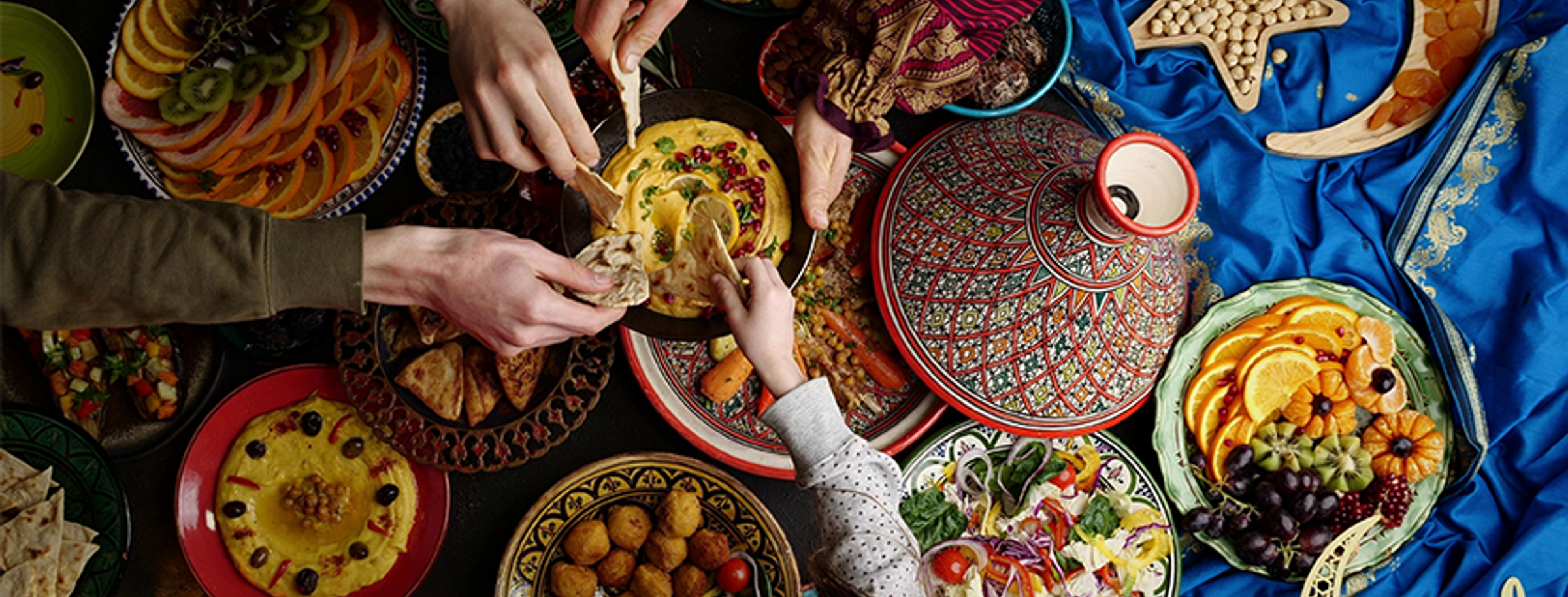 Dates and dishes laid out for an iftar meal