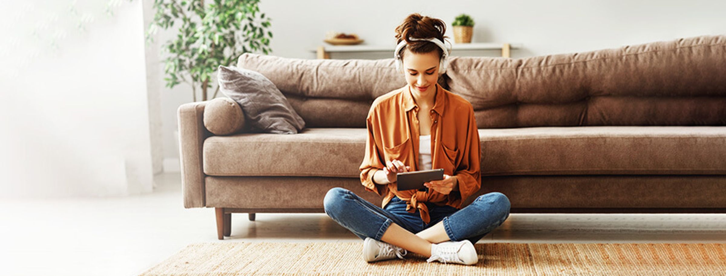 A woman reading the news on a tablet