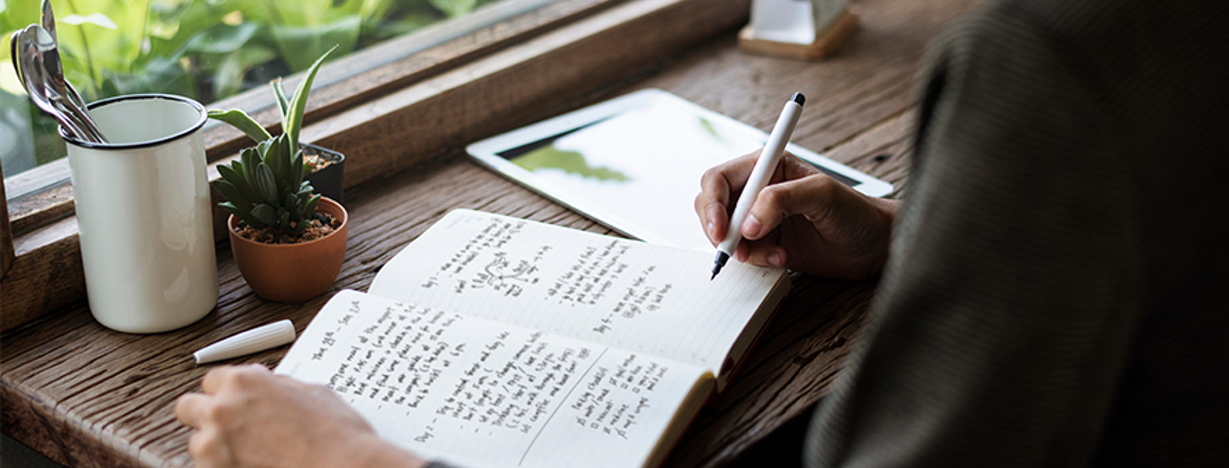 Woman writing in a journal