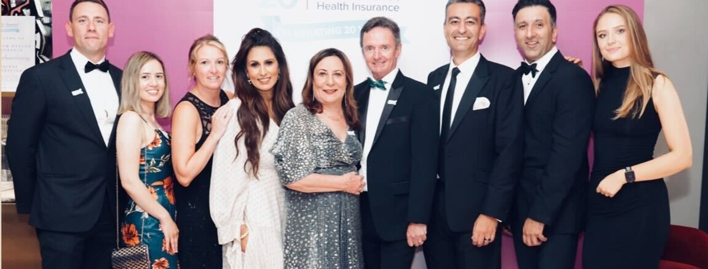 Freedom Health Insurance staff celebrating the company's 20th anniversary
