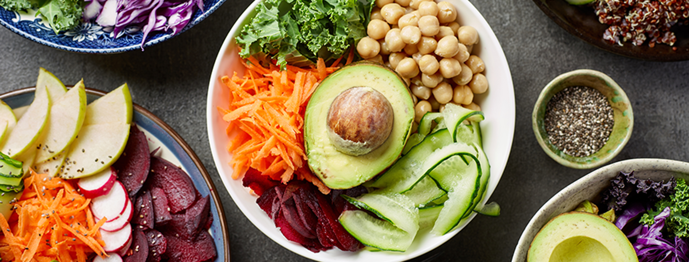 Bowls of colourful vegan dishes on a table