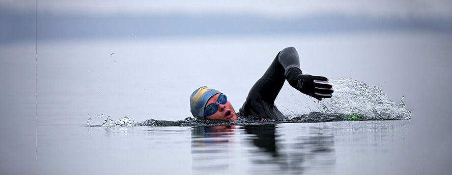 Person swimming in the sea in cold water