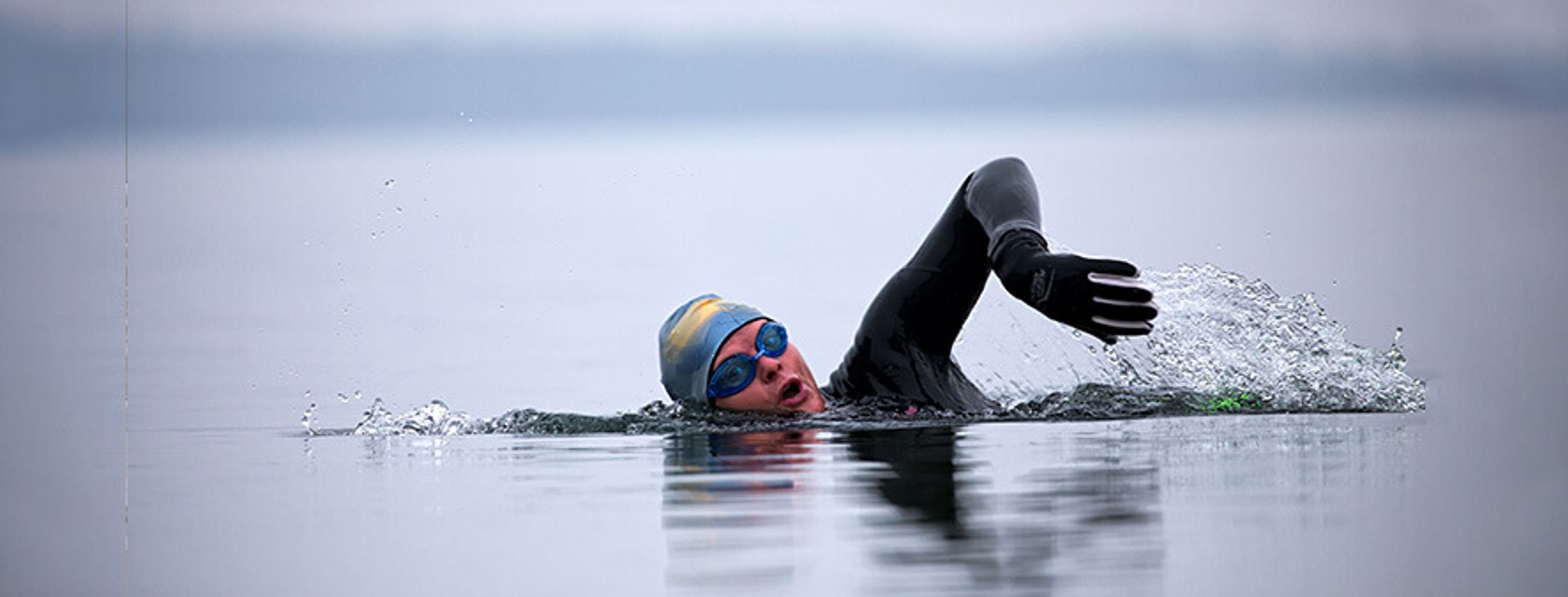 Person swimming in the sea in cold water