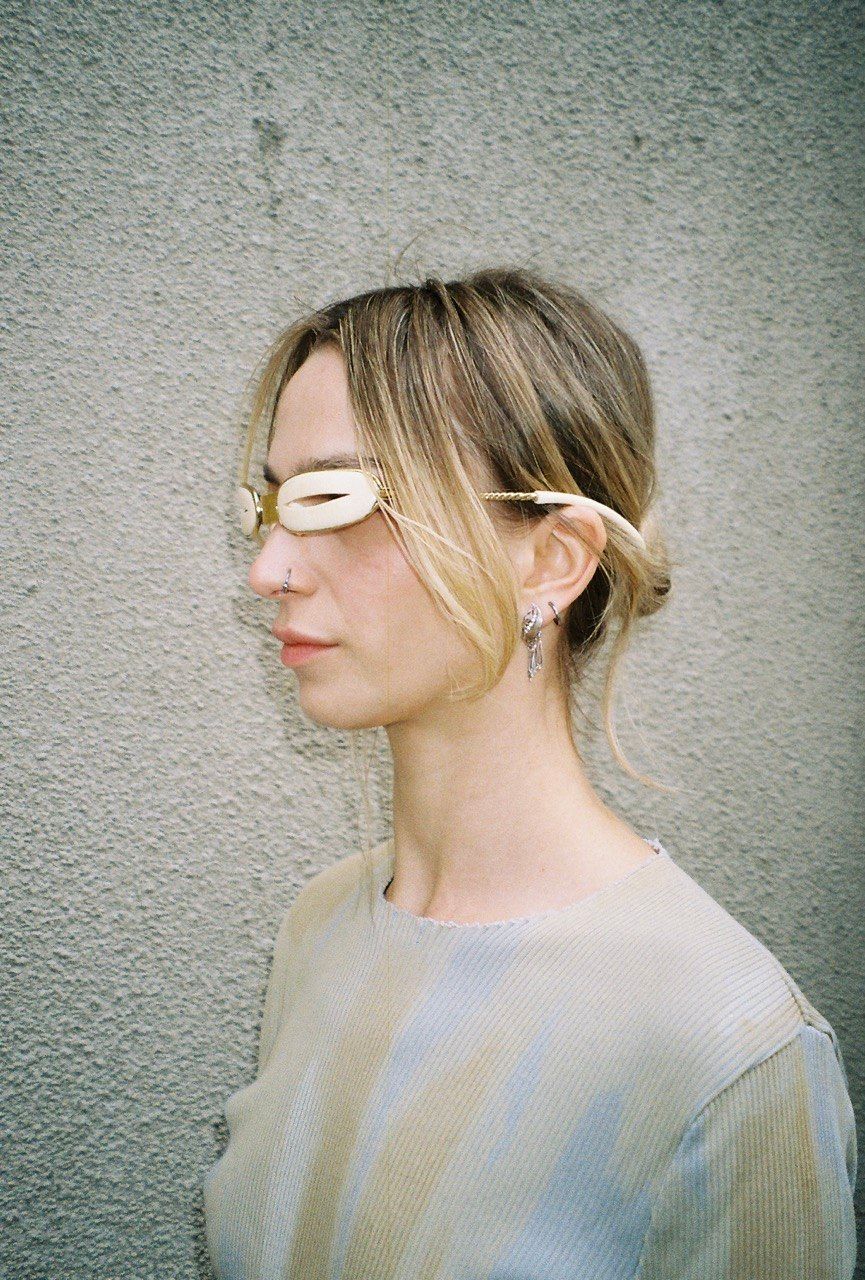 woman wears mammoth tusk visor arctic goggles side