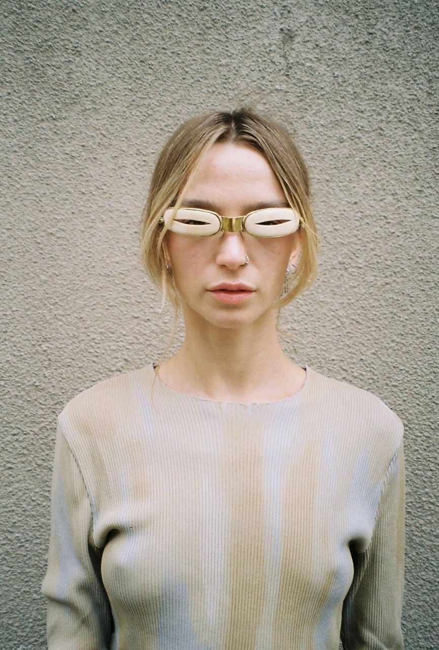 woman wears mammoth tusk visor arctic goggles profile