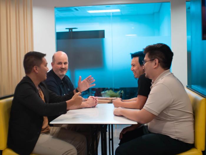 A client meeting their team in person.