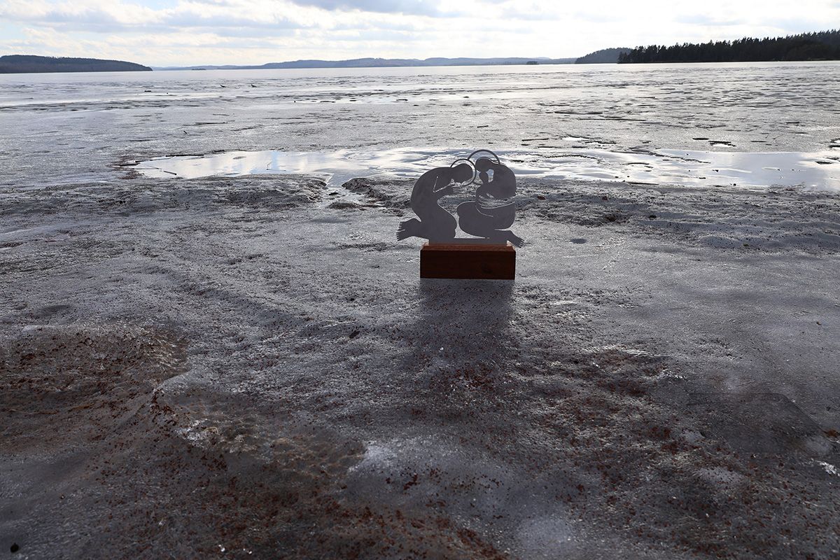 Jolanta Johnsson, Holy Family sculpture on icy lake