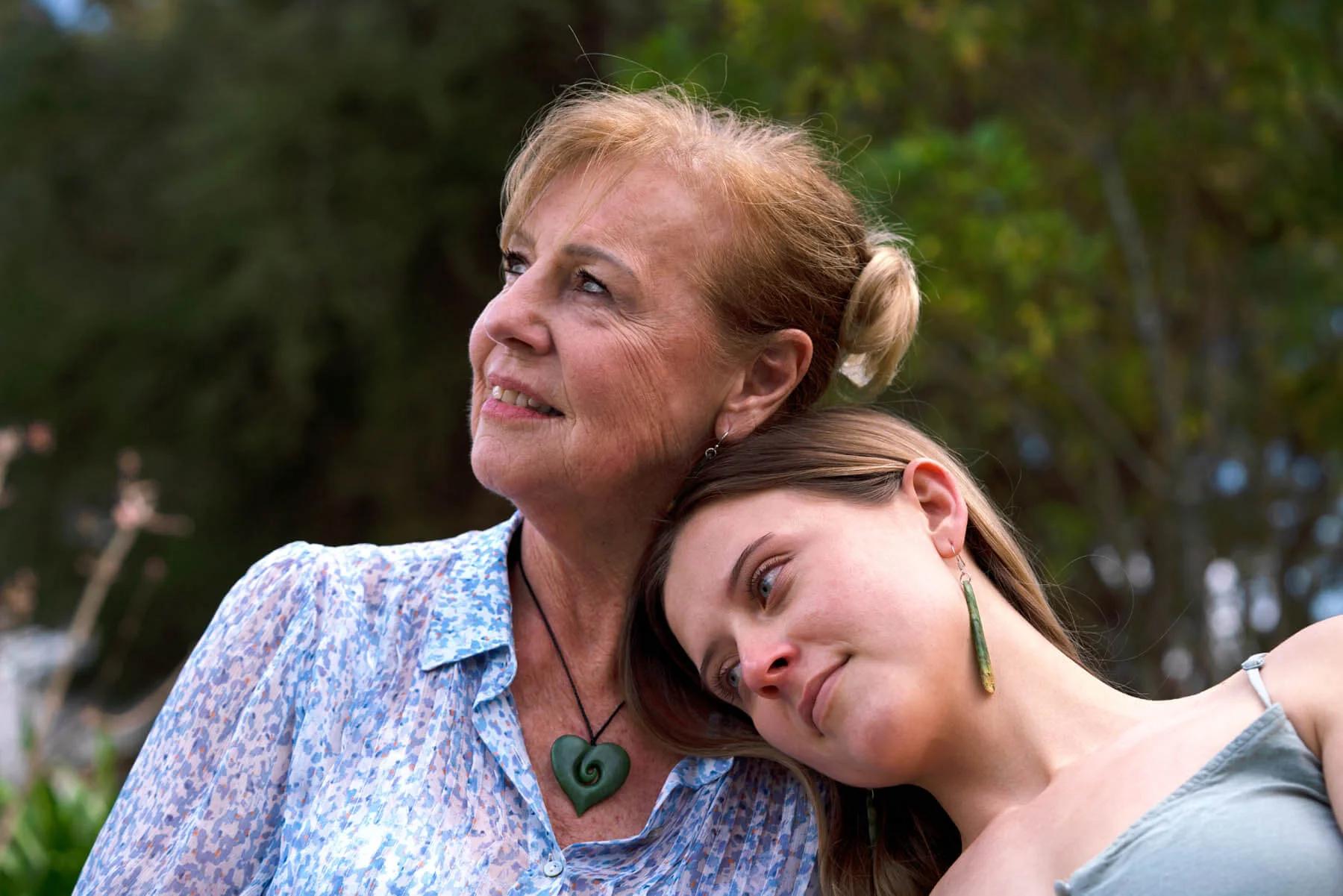 Mother and Daughter Wearing Heart Necklace