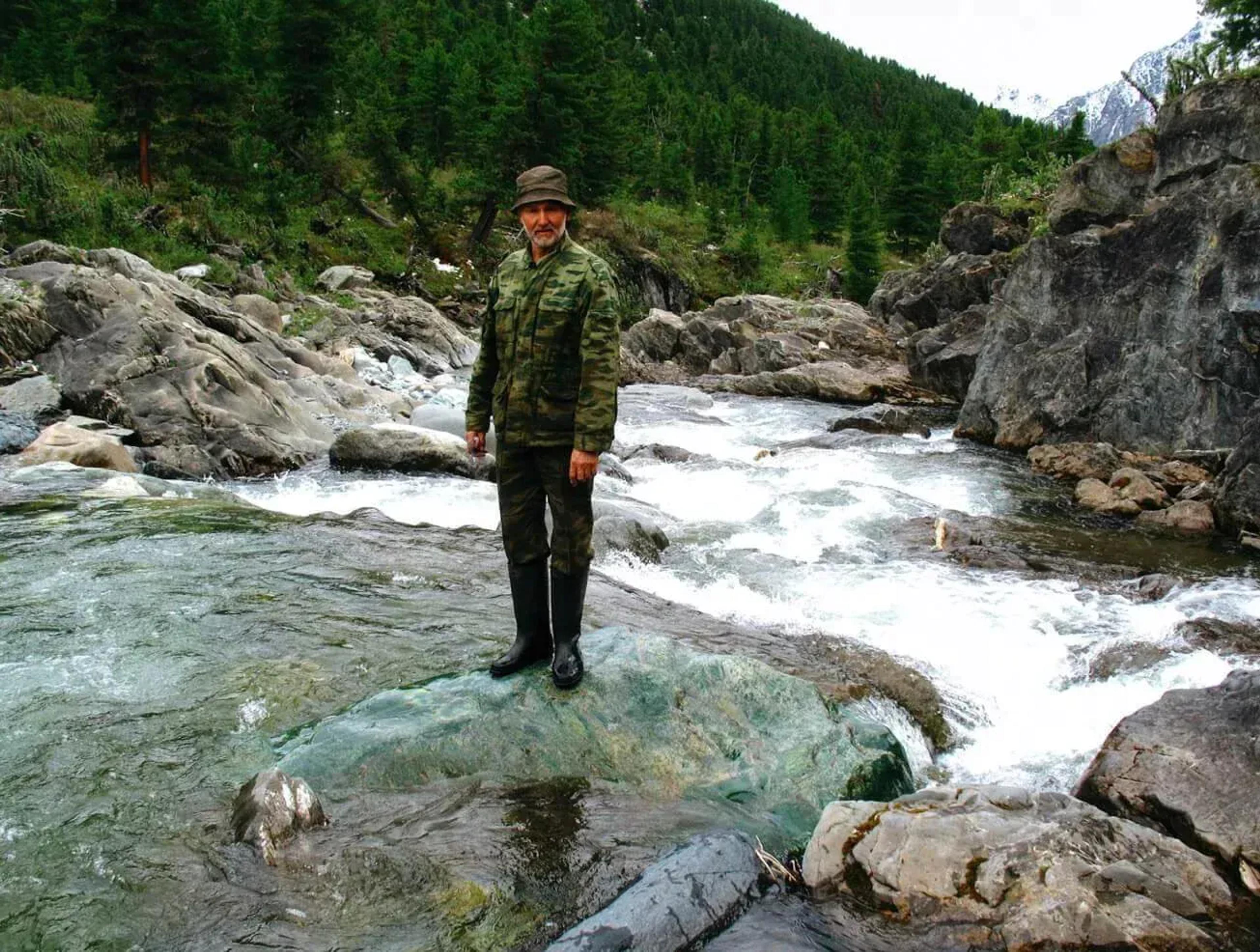 man standing in river