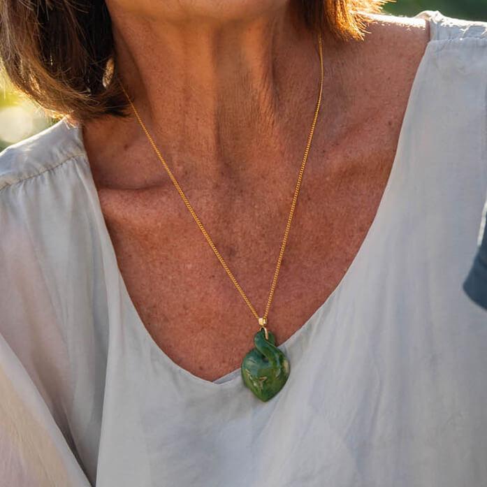 Lady wearing gold greenstone twist