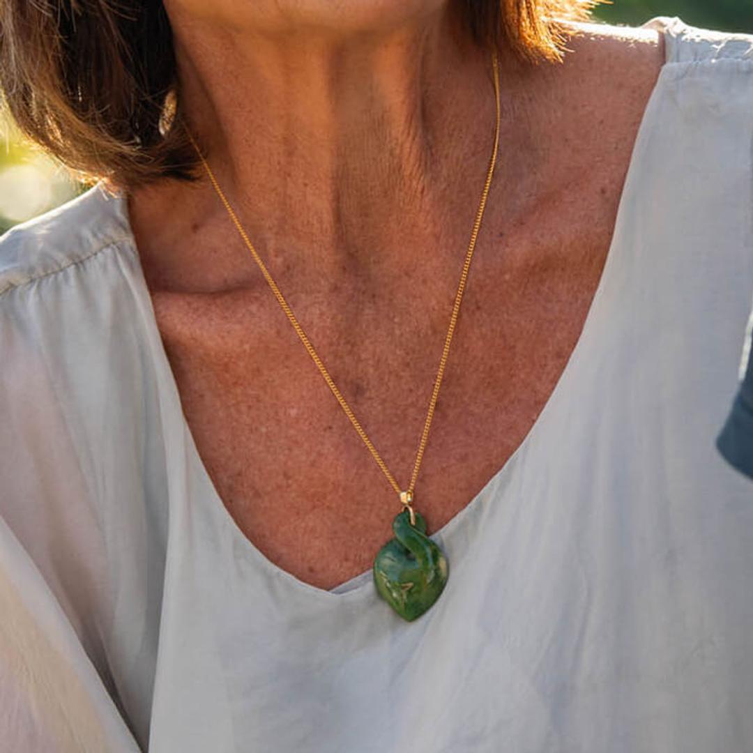Lady wearing gold greenstone twist