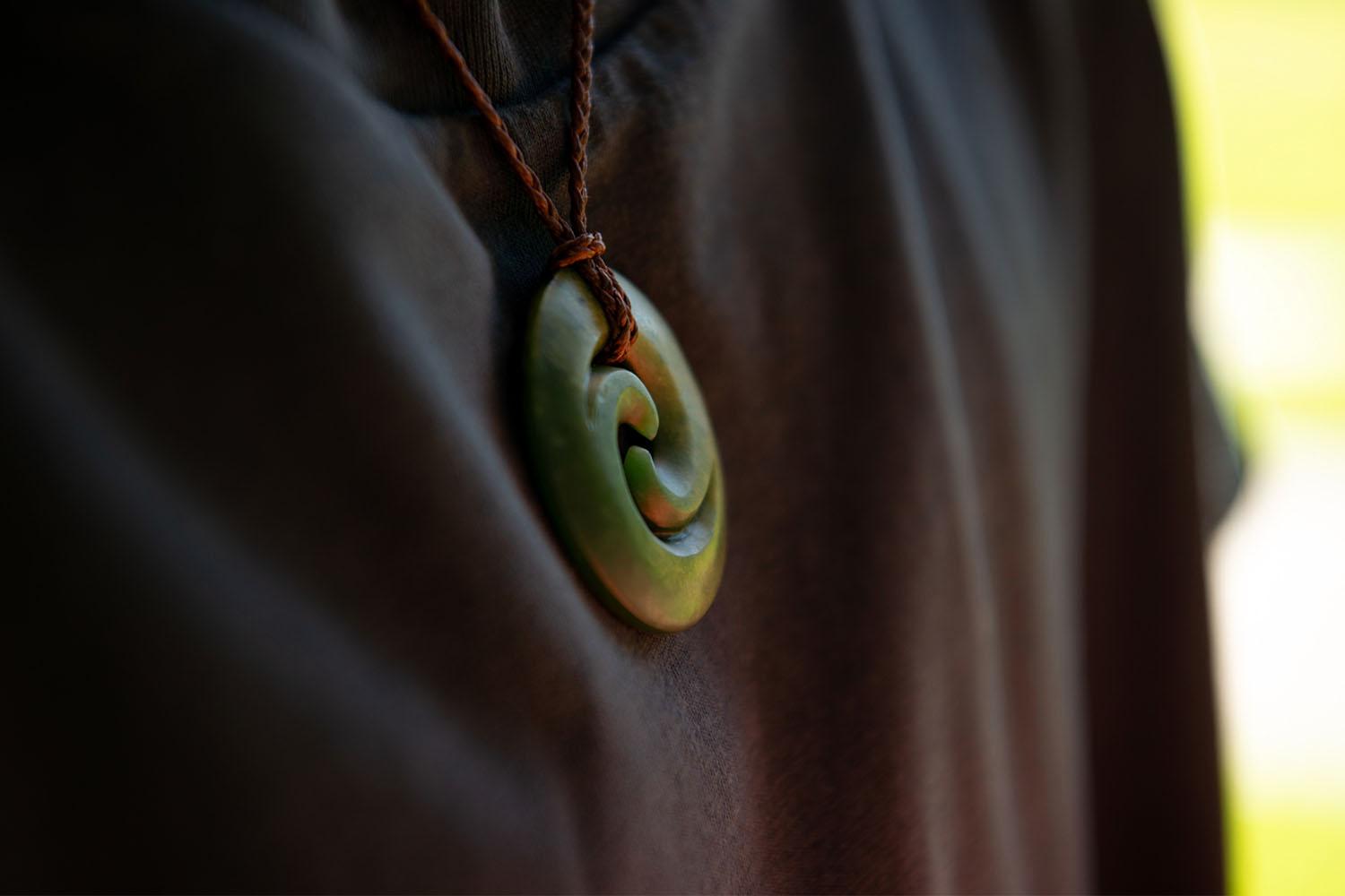 Close up of double koru necklace