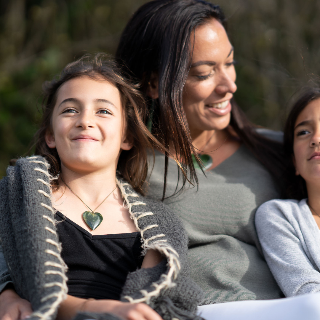 Child wearing pounamu heart