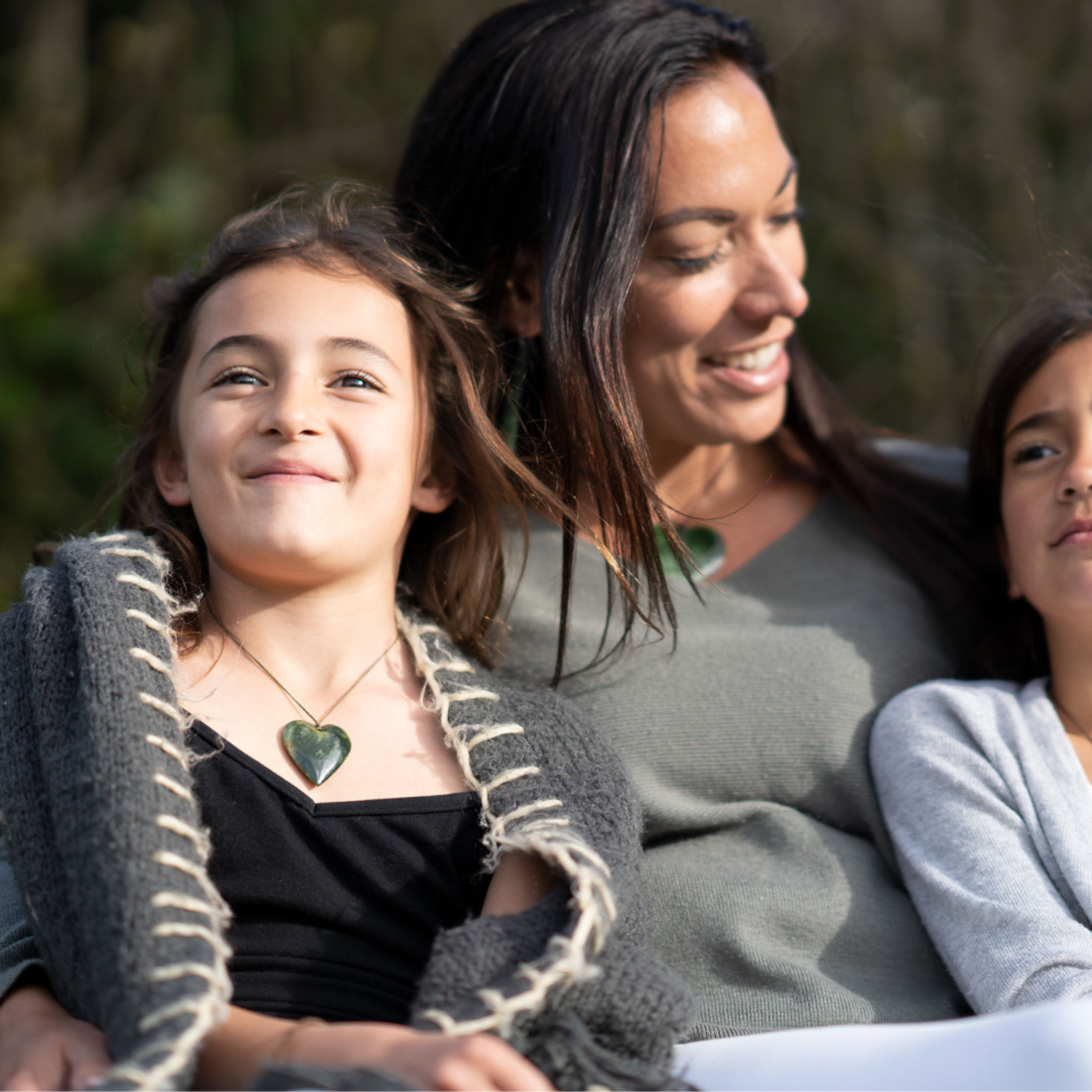 Child wearing pounamu heart