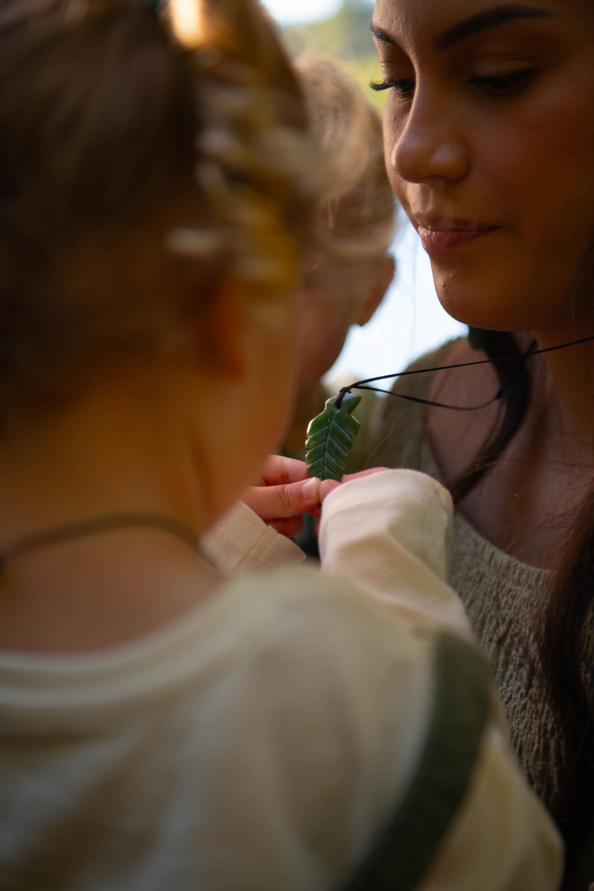 Mother and daughter with fern