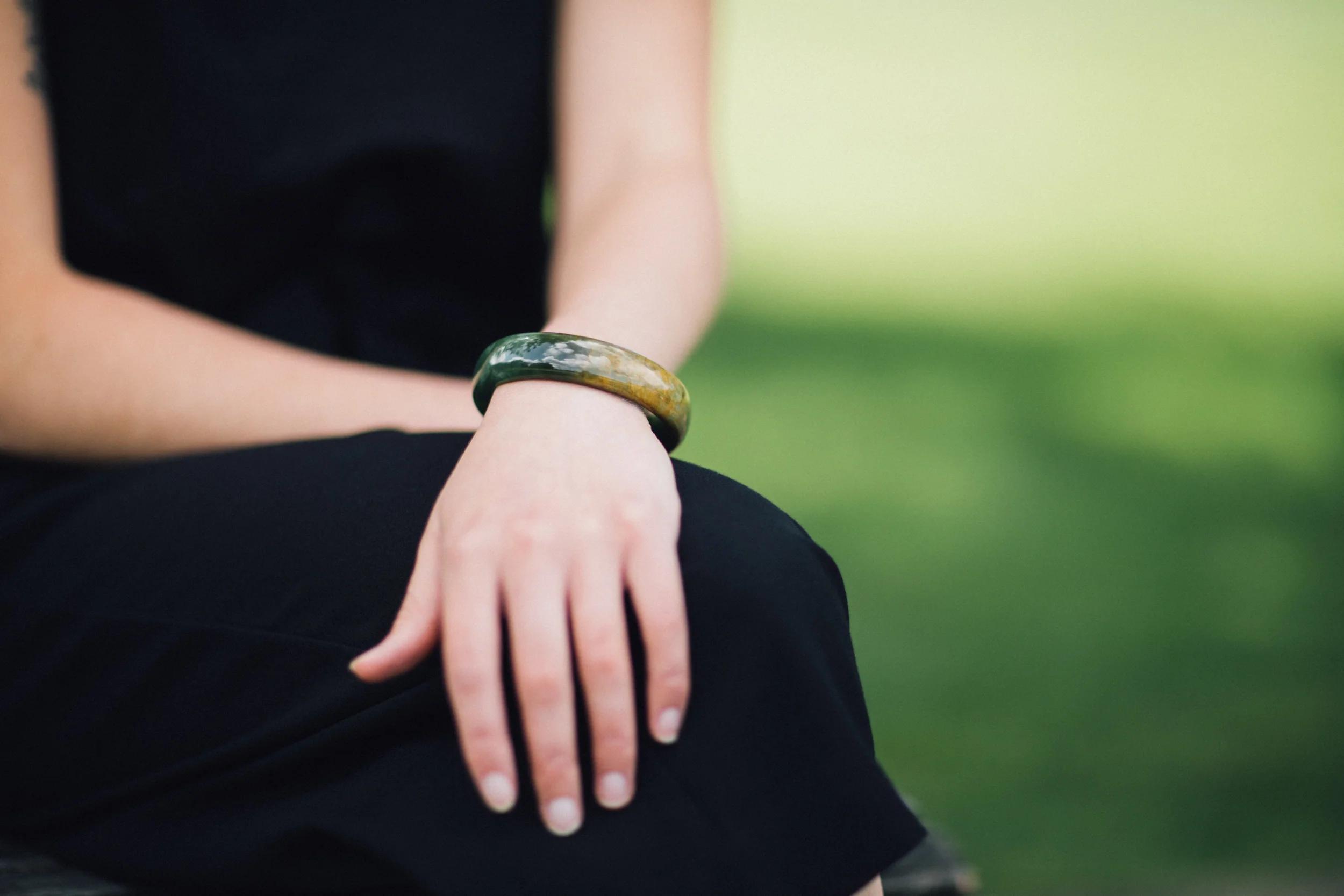 Lady wears New Zealand Flower Jade Bangle