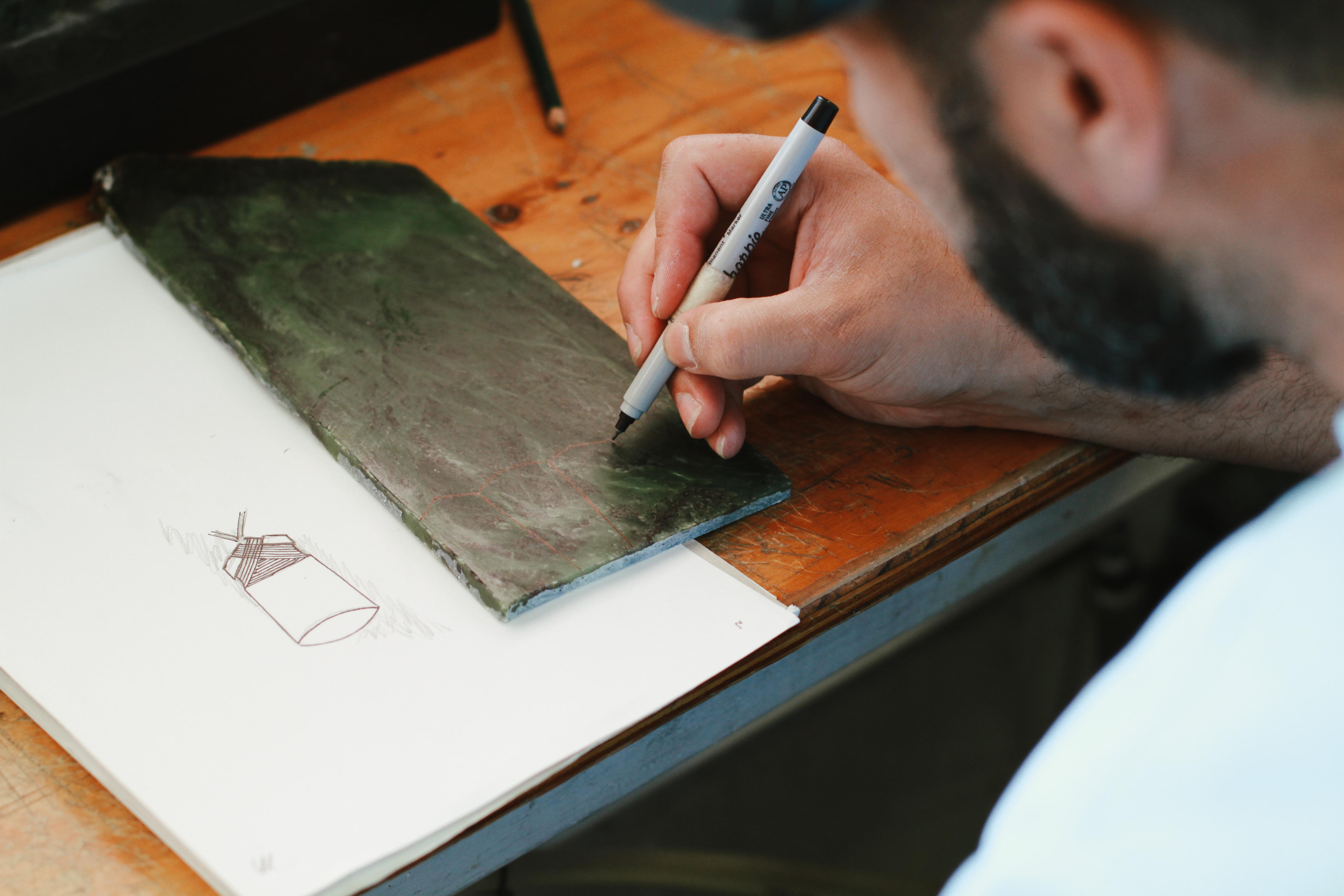 Tamaora Walker carving a toki