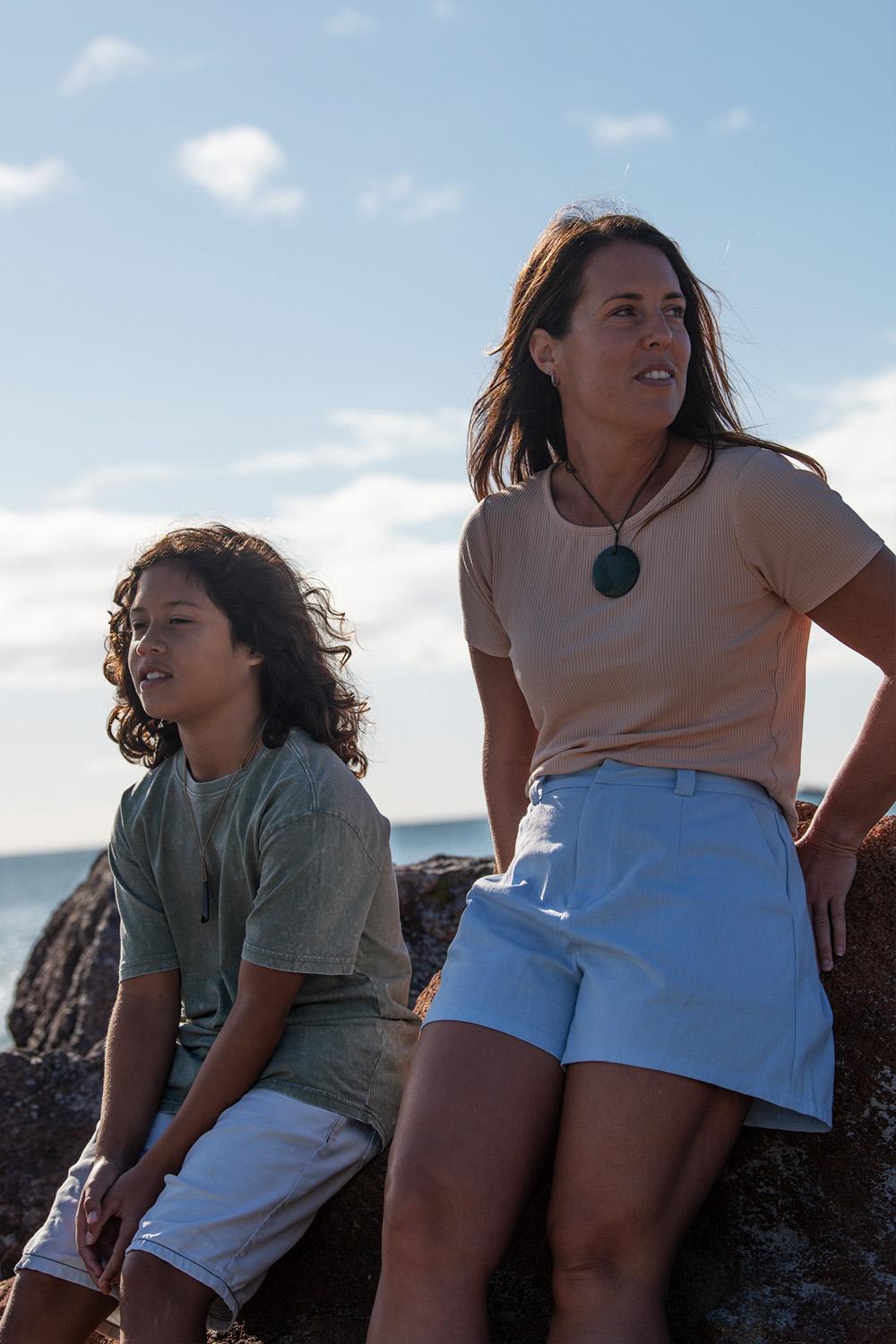 Lady wears New Zealand Pounamu Disc in beautiful setting