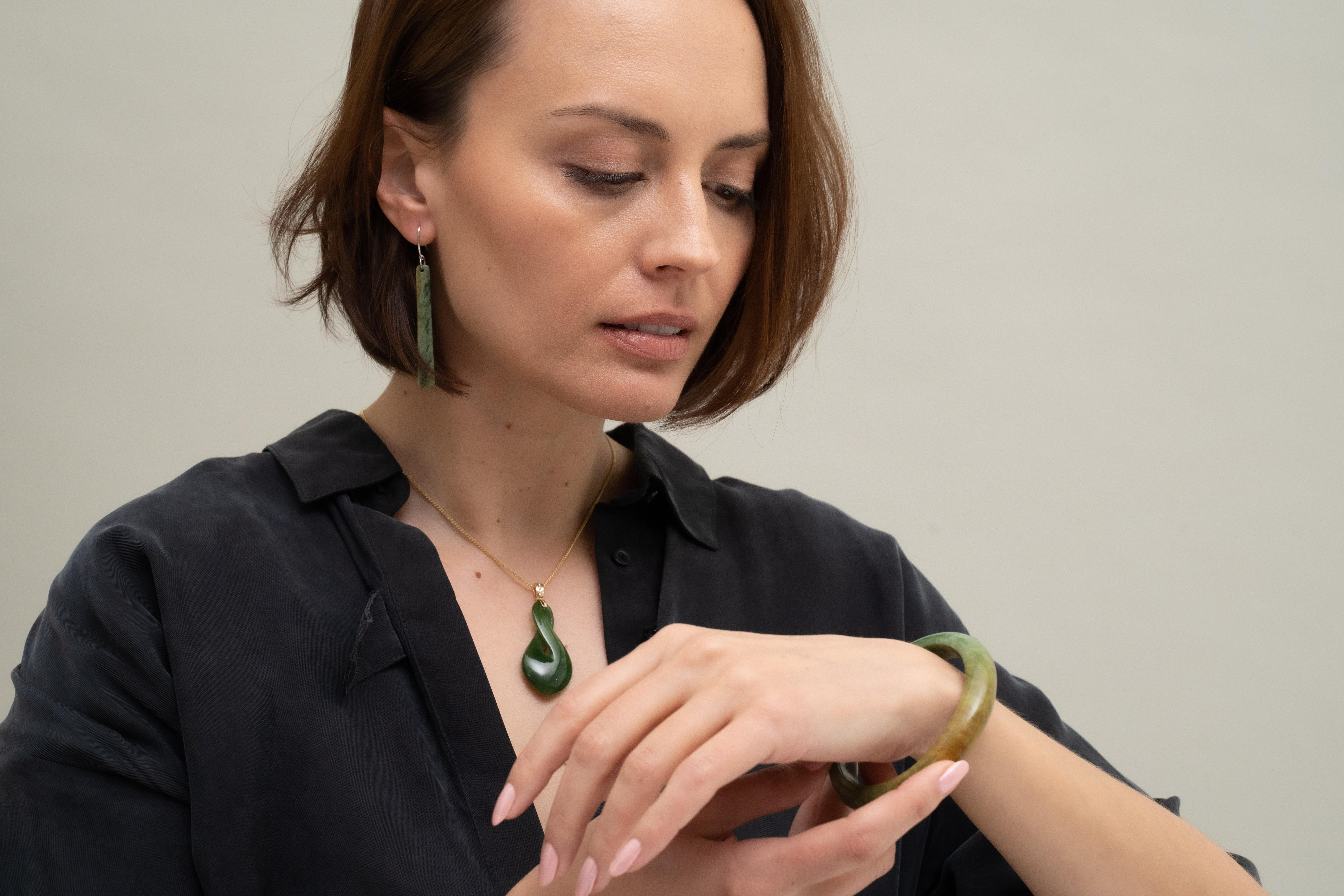 Lady admires pounamu bangle