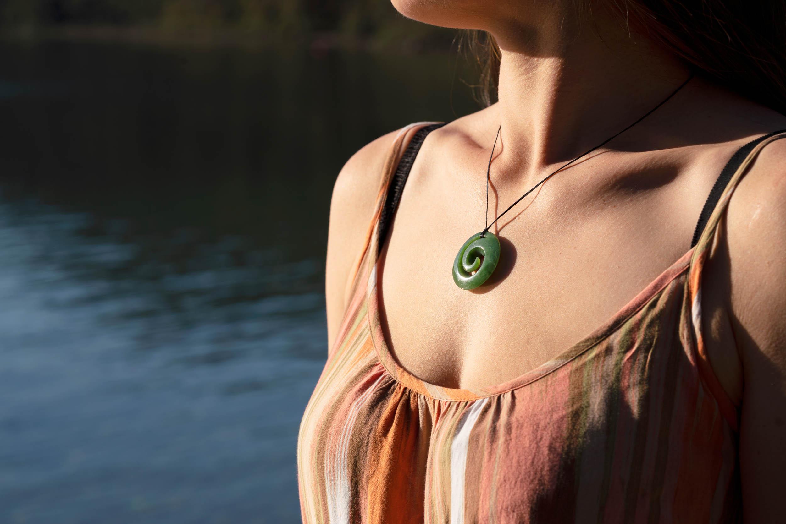 Women wearing pounamu necklace in iconic New Zealand location