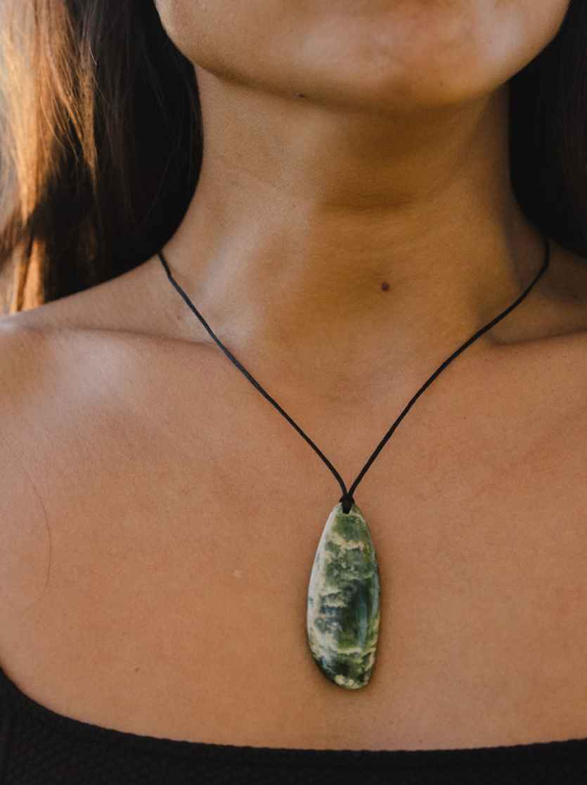 women wearing roimata pounamu