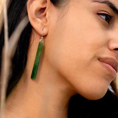 Lady wearing jade earrings