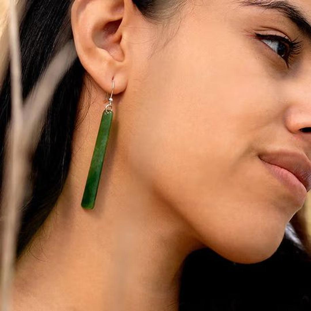 Lady wearing jade earrings