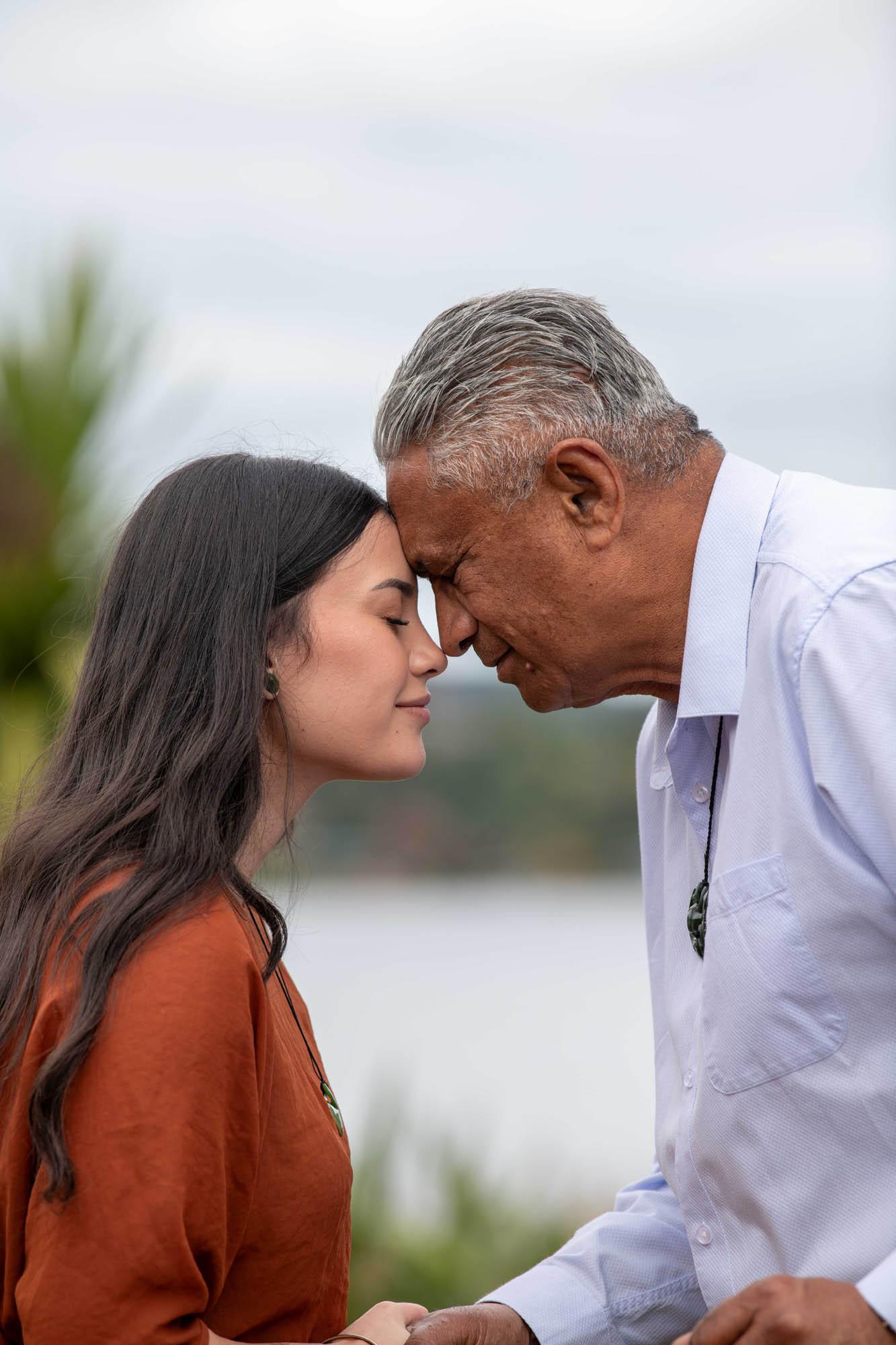 Whanau share hongi with Hei Tiki