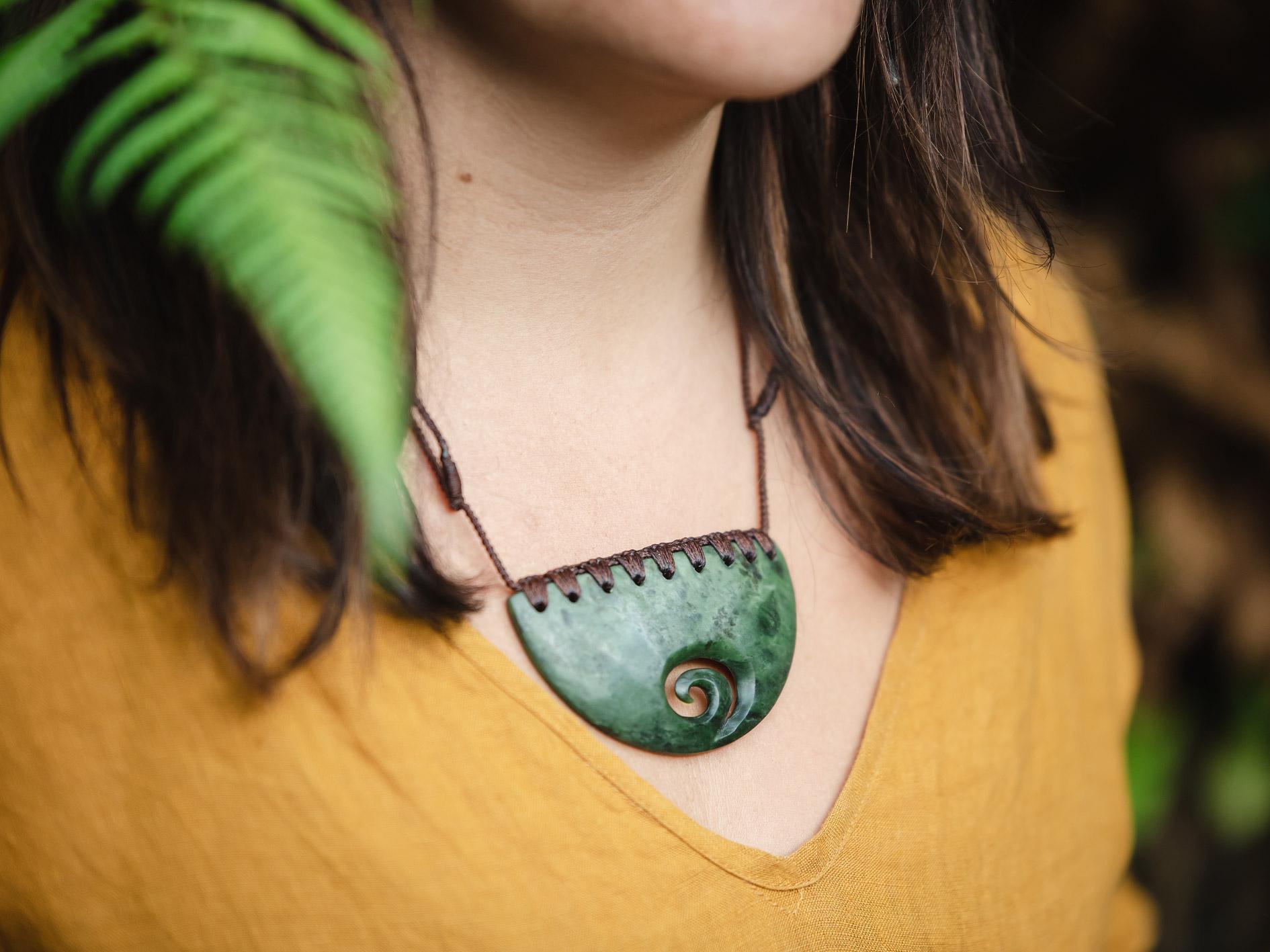 Pounamu breastplate incorporating the koru in the design