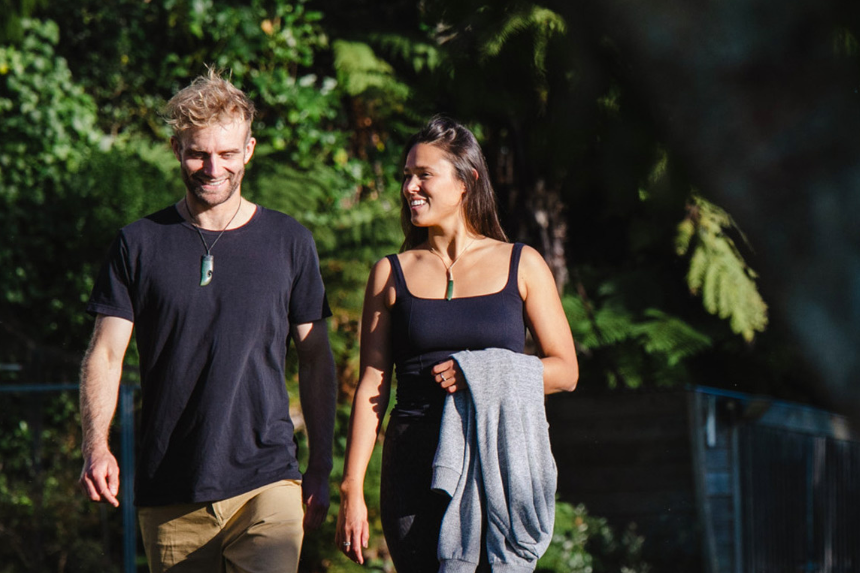 Couple by waters edge wear pounamu roimata