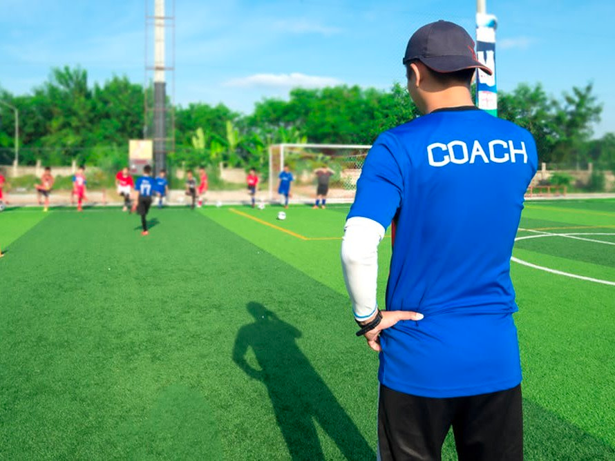 a coach on the soccer field