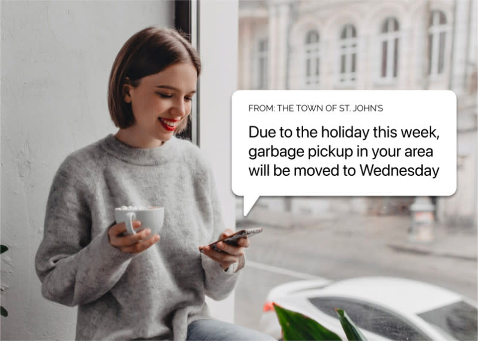 a picture of a women receiving a text notifying her that garbage pickup will be moved to next week