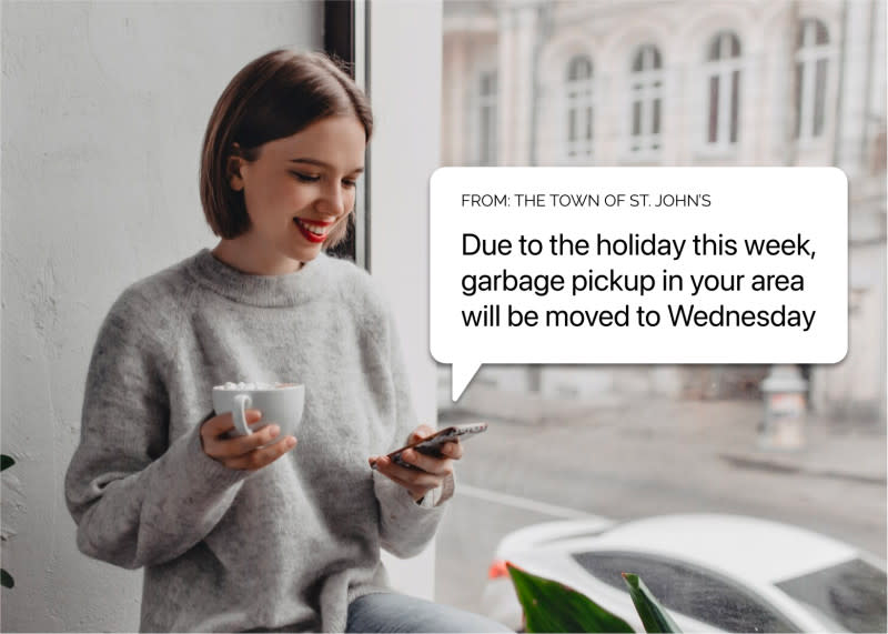 a picture of a women receiving a text notifying her that garbage pickup will be moved to next week a picture of a women receiving a text notifying her that garbage pickup will be moved to next week