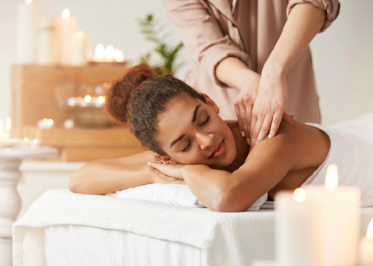 a woman getting a massage at a spa