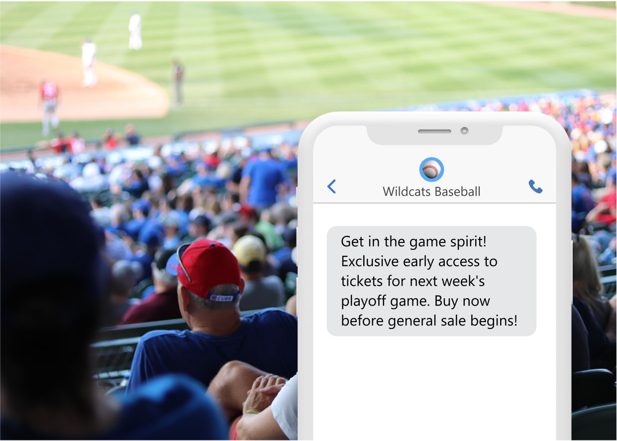 a phone showing a promo text from a baseball team about early tickets with a stadium in the background