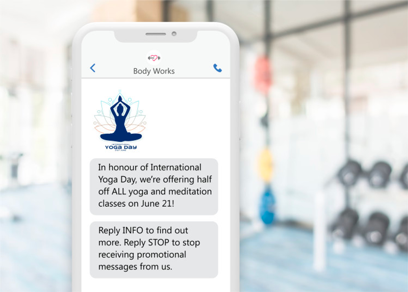 a phone showing a sms message for a fitness studio offering a discount on yoga classes a phone showing a sms message for a fitness studio offering a discount on yoga classes
