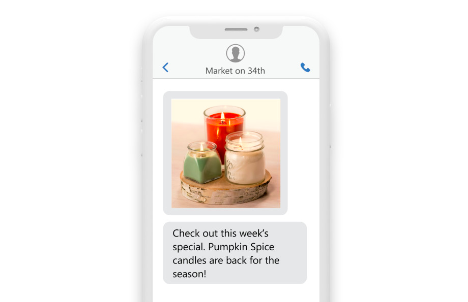 a phone with the message “Check out this week’s special, the Pumpkin Spice Candles are back for the season!”