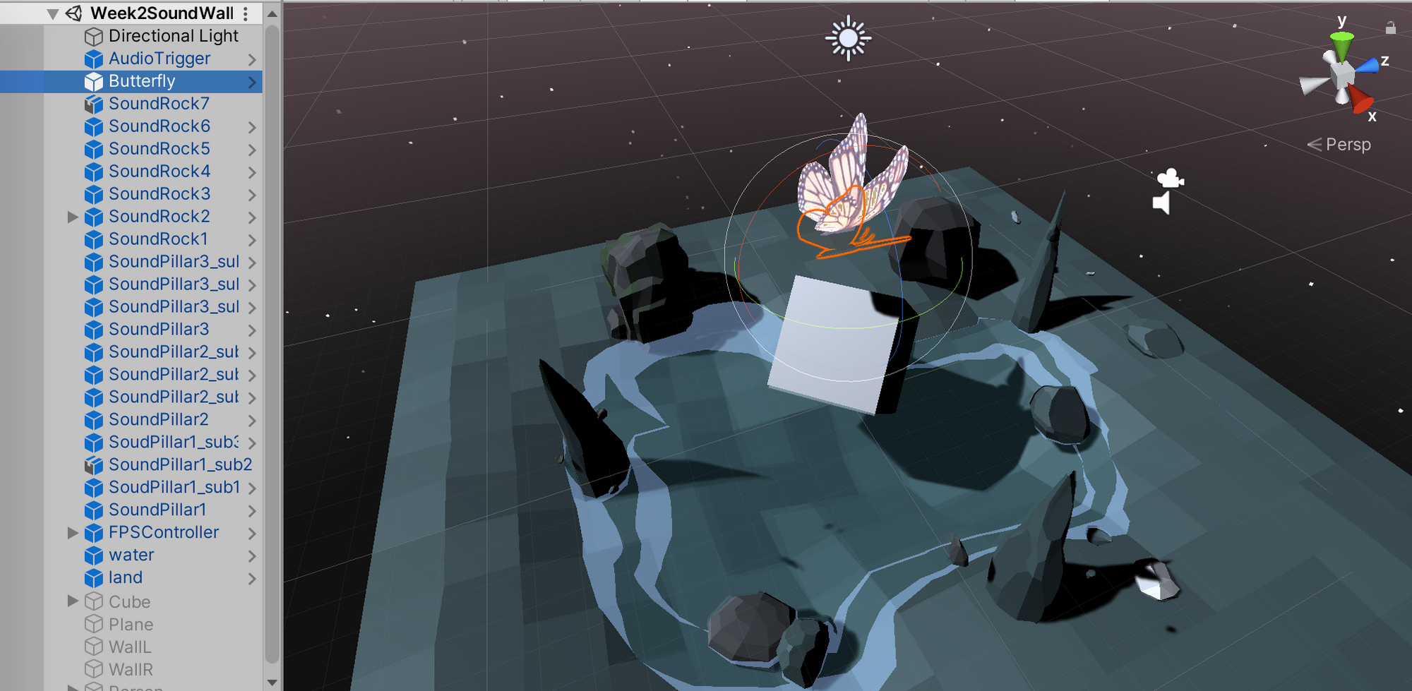 Screen capture of unity with 3d scenes depicting rocks surrounding a pond with a giant cube with butterfly