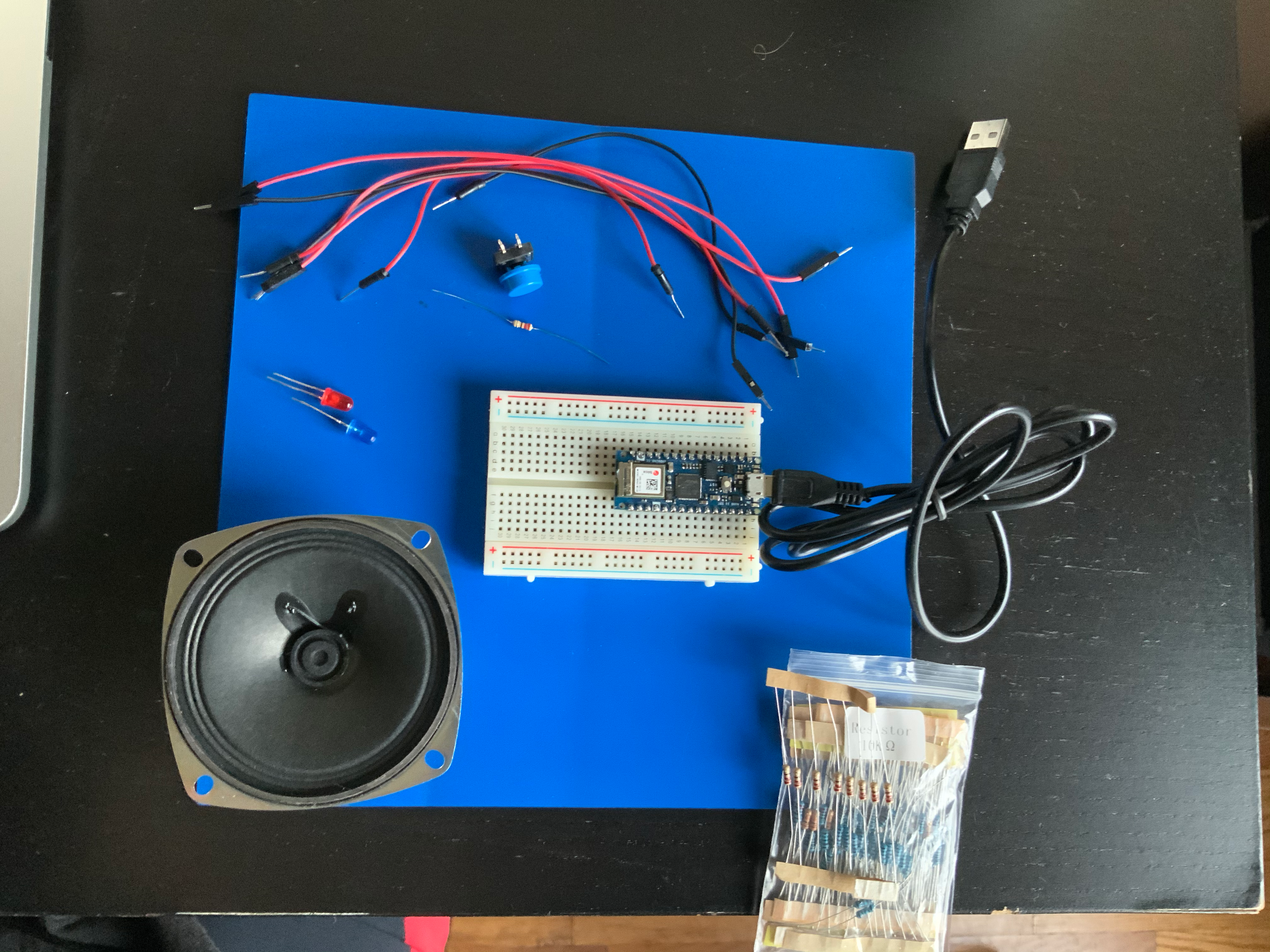Photo of an Arduino nano 33 IoT connected to LEDs and Pushbuttons