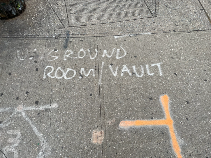 Underground Room/Vault sign written in spray paint at a construction site