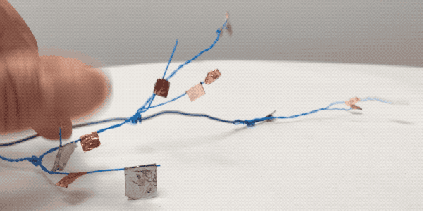 Video of touching copper tape leaves attached to wire branches to make sounds