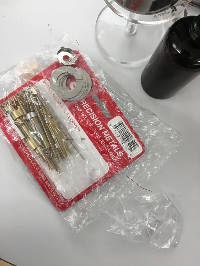 Photo of materials used for the pendulum: scrap metal pieces, acrylic beads