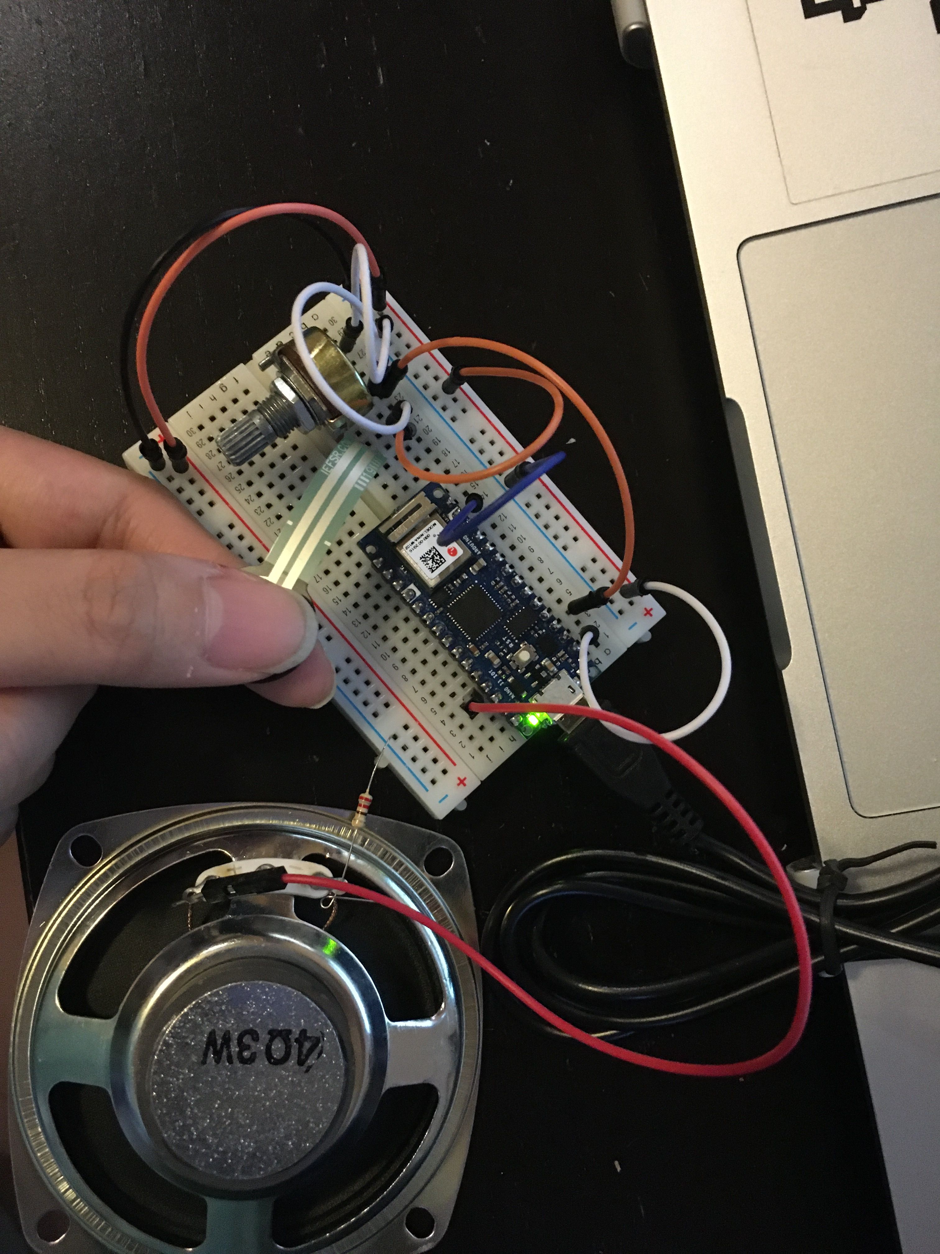 Photo of arduino with force sensors connected to laptop and a speaker