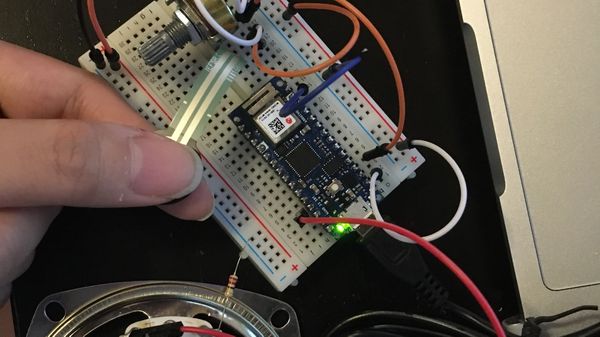 Photo of arduino with force sensors connected to laptop and a speaker