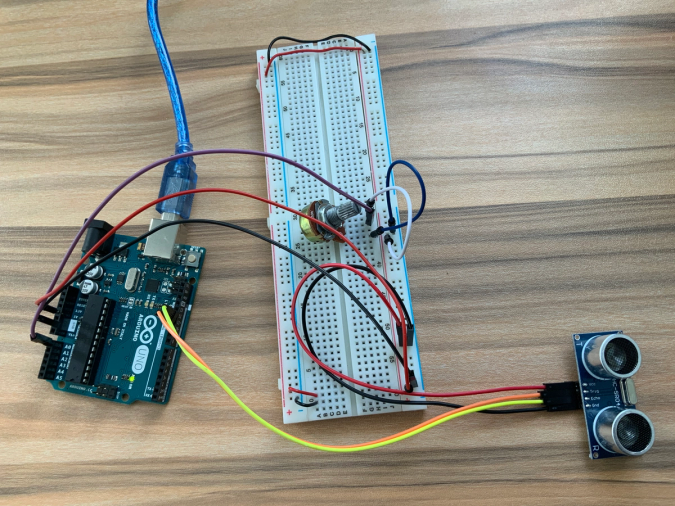 Arduino uno connected with an ultrasonic sensor and potentiometer