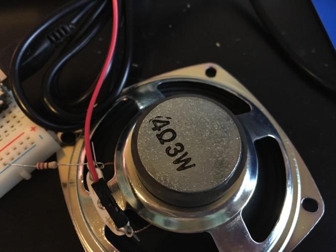 Photo of a speaker that says 4 ohms and 3 watts in the back