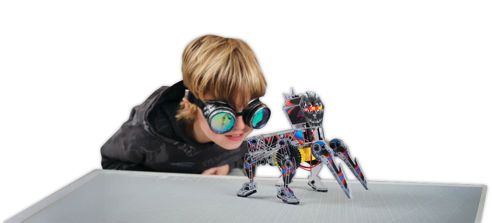 Boy wearing Protective Goggle and playing with CircuitMess Charlie