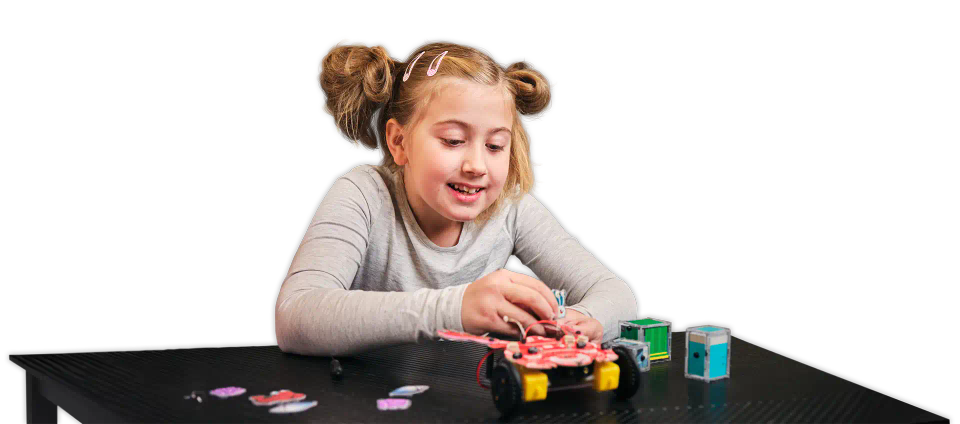 Girl playing with CircuitMess Dusty