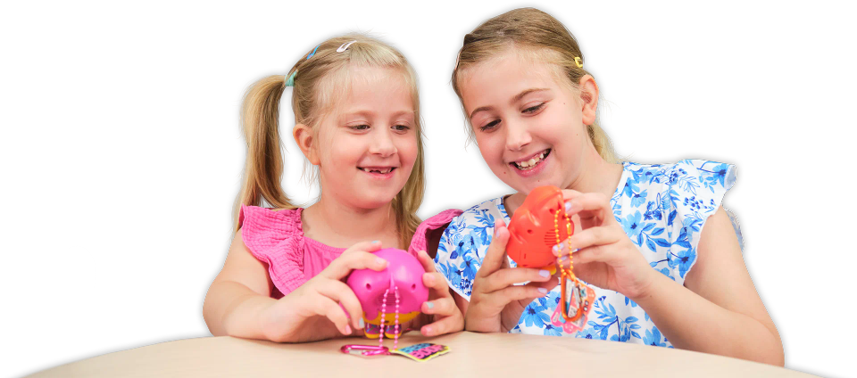 Two girls playing with CircuitMess Beep Boop Tochi and Mochi.